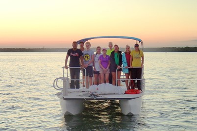 NGHS students on a pontoon boat at sunset